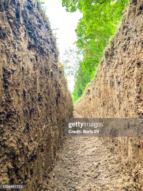 trench in clay - trench stock pictures, royalty-free photos & images