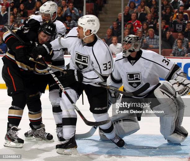Brandon McMillan of the Anaheim Ducks battles outside the crease against Willie Mitchell of the Los Angeles Kings during the game on November 17,...