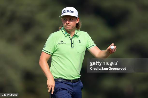 Cam Smith acknowledges the crowd on the 17th hole during the third round of the World Golf Championship-FedEx St Jude Invitational at TPC Southwind...