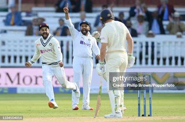 Virat Kohli and Rohit Sharma of India celebrate after the dismissal of Jos Buttler of England during the fifth day of the 2nd LV= Test Match between...