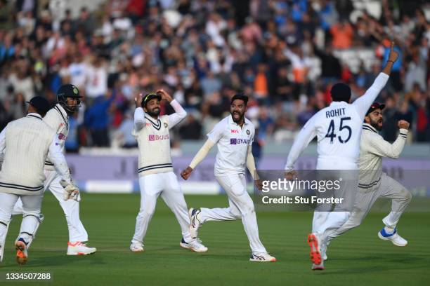 India bowler Mohammed Siraj celebrates with captain Virat Kohli after taking the wicket of Jos Buttler during day five of the second Test Match...