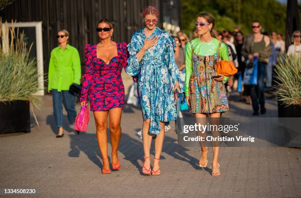 Janka Polliani wearing dress, Marianne Theodorsen wearing blue dress with floral print and Annabel Rosendahl wearing dress, and Bottega Veneta bag in...