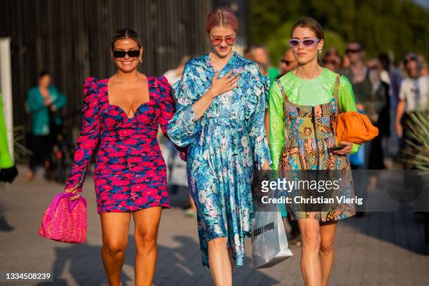 Janka Polliani wearing dress, Marianne Theodorsen wearing blue dress with floral print and Annabel Rosendahl wearing dress, and Bottega Veneta bag in...