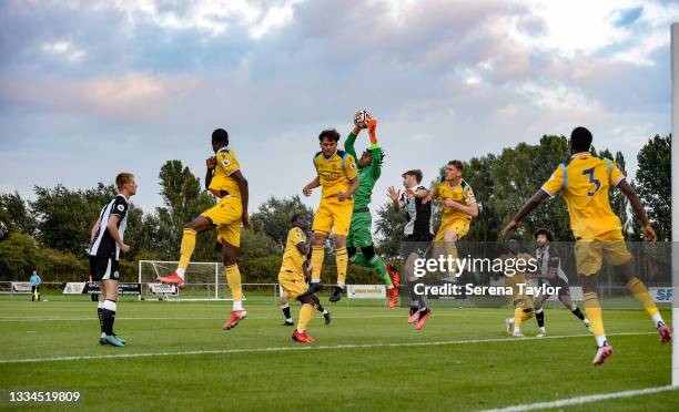 Reading FC Goalkeeper Coniah Boyce-Clarke jumps high in the air to catch a cross during the Premier League 2 match between Newcastle United and...