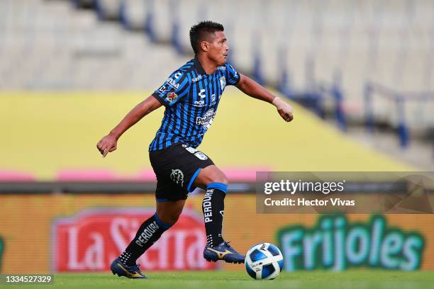 Osvaldo Martinez of Queretaro kicks the ball during the 4th round match between Pumas UNAM and Queretaro as part of the Torneo Grita Mexico A21 Liga...