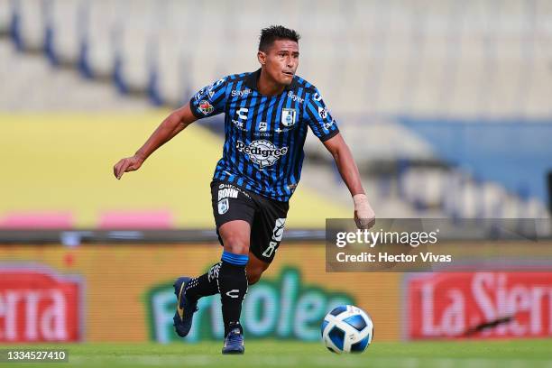 Osvaldo Martinez of Queretaro kicks the ball during the 4th round match between Pumas UNAM and Queretaro as part of the Torneo Grita Mexico A21 Liga...