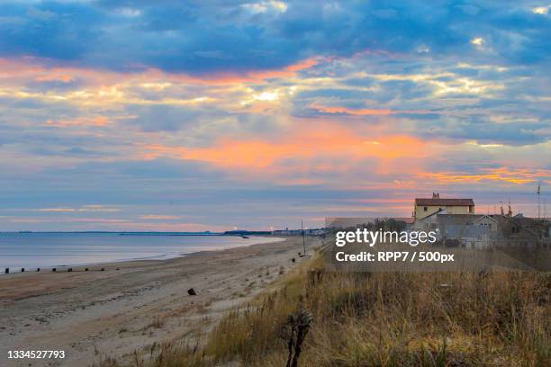 scenic view of beach against sky during sunset,destin,florida,united states,usa - destin beach stock-fotos und bilder