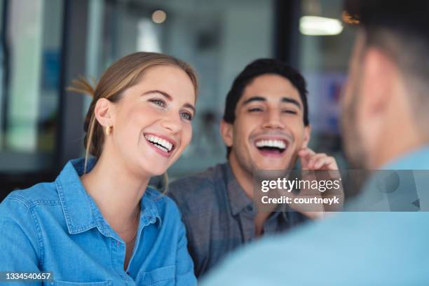 financial advisor discussing business with couple. - smiling teeth stock pictures, royalty-free photos & images