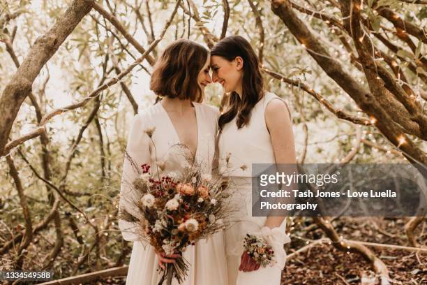same sex elopement wedding - boho wedding dresses stock pictures, royalty-free photos & images