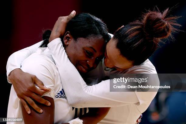 Grace Zaadi Deuna and Allison Pineau of Team France embrace each other after defeating Team ROC 30-25 to win the gold medal in Women's Handball on...