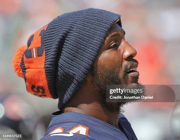 Robert Quinn of the Chicago Bears watches as teammates take on the Miami Dolphins during a preseason game at Soldier Field on August 14, 2021 in...