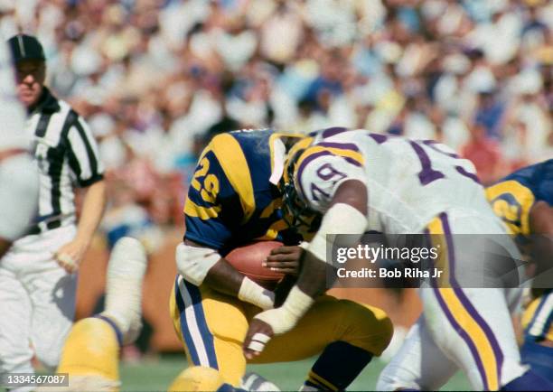 Los Angeles Rams RB Eric Dickerson goes helmet-to-helmet with Minnesota Vikings DE Doug Martin during NFL game action of Los Angeles Rams against...