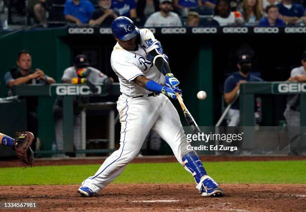Salvador Perez of the Kansas City Royals hits a two-run single in the eighth inning against the Houston Astros at Kauffman Stadium on August 16, 2021...