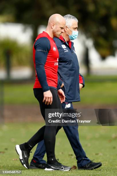 Nathan Jones of the Demons speaks with Melbourne Head of Development Mark Williams during a Melbourne Demons AFL training session at Gosch's Paddock...