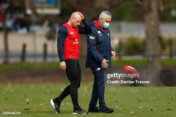 Nathan Jones of the Demons speaks with Melbourne Head of Development Mark Williams during a Melbourne Demons AFL training session at Gosch's Paddock...