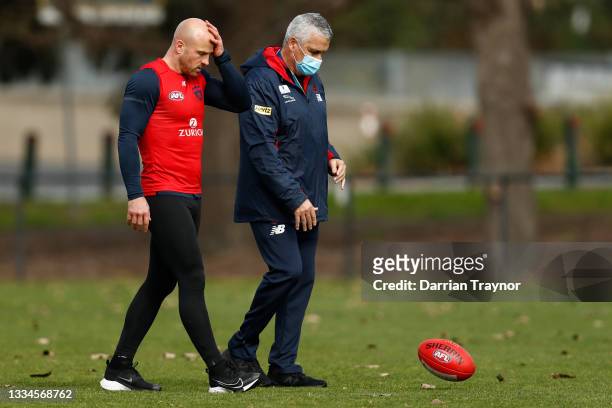 Nathan Jones of the Demons speaks with Melbourne Head of Development Mark Williams during a Melbourne Demons AFL training session at Gosch's Paddock...