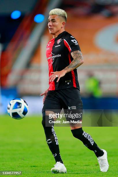 Luis Ricardo Reyes of Atlas drives the ball during the 3rd round match between Pachuca and Atlas as part of the Torneo Grita Mexico A21 Liga MX at...