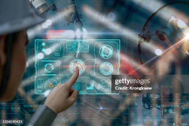 female engineer working with automation robot arms machine in intelligent factory industrial. - mobile app car stock pictures, royalty-free photos & images