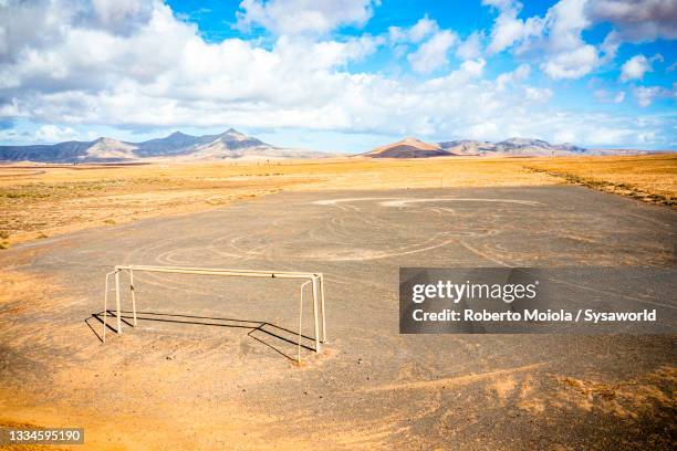 empty soccer field in the desert,  fuerteventura - empty football pitch stock pictures, royalty-free photos & images