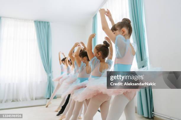 little ballet troupe practicing together - dance troupe stock pictures, royalty-free photos & images