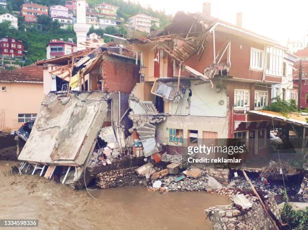 earthquake destruction concept. financial losses caused by multiple natural disasters. photograph of destroyed houses and flooded city. photograph of damage caused by natural disaster. - collapsing stock pictures, royalty-free photos & images