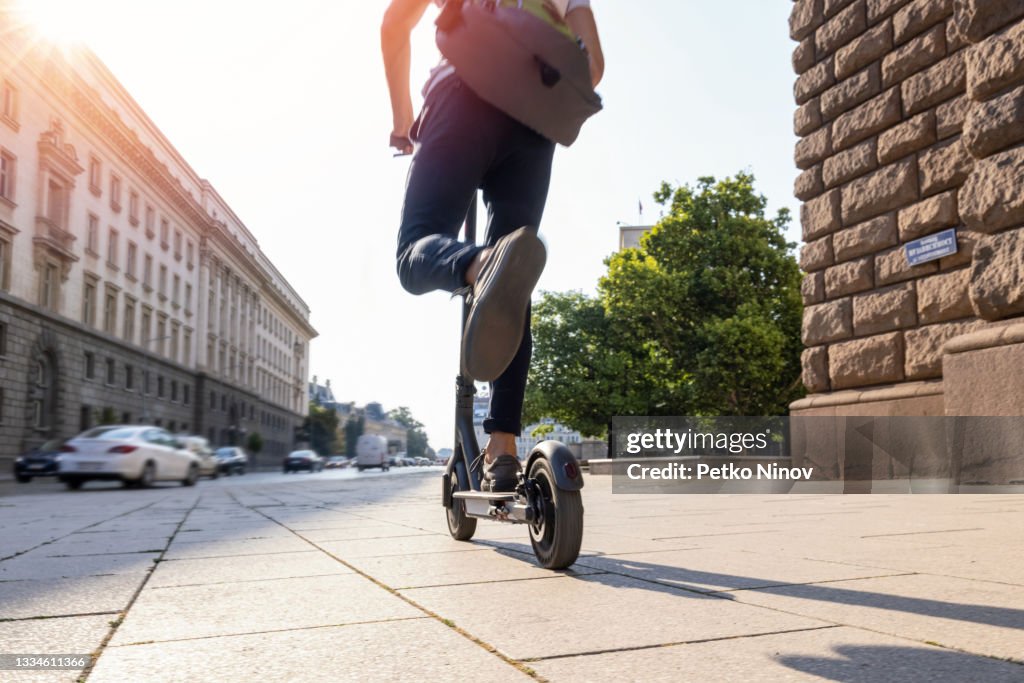 Man riding electric scooter in the morning