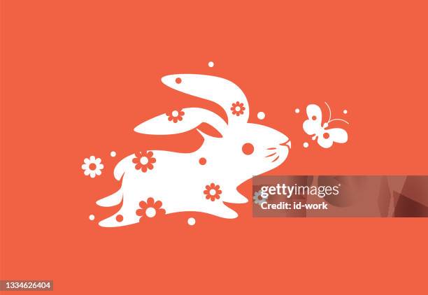 bunny running with flower and butterfly symbol - chasing butterflies stock illustrations