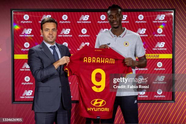 Roma new signing Tammy Abraham poses with his new jersey alonside Club's General Manager football Tiago Pinto at Centro Sportivo Fulvio Bernardini on...