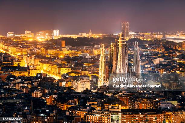 barcelona skyline with sagrada familia at night, catalonia, spain - sagrada familia barcelona stock pictures, royalty-free photos & images