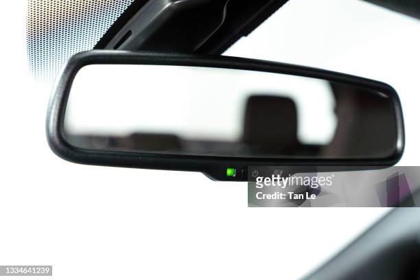 close-focus of a rear view mirror inside a modern car - rückspiegel stock-fotos und bilder