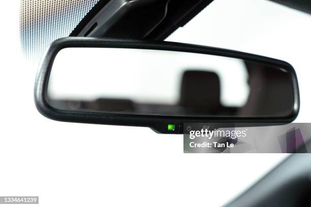 close-focus of a rear view mirror inside a modern car - car rear view mirror stock pictures, royalty-free photos & images