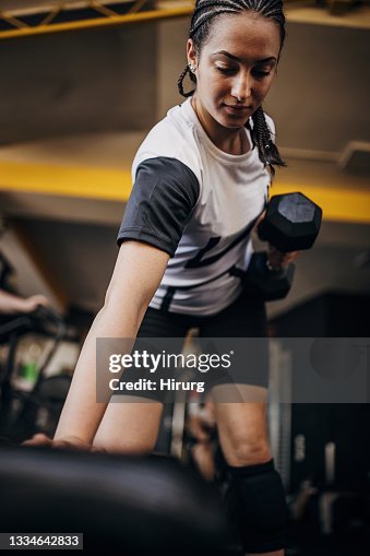 Young woman training in gym Young woman training in gym