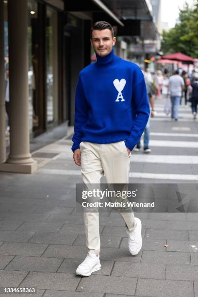 Paul-Henry Duval, Fashion Influencer, was seen wearing Ami Paris turtleneck pullover in blue with big branding, Dondup chino trousers in beige,...