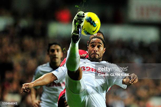 Swansea City's Welsh defender Ashley Williams clears the ball during the English Premier League football match between Swansea City and Manchester...