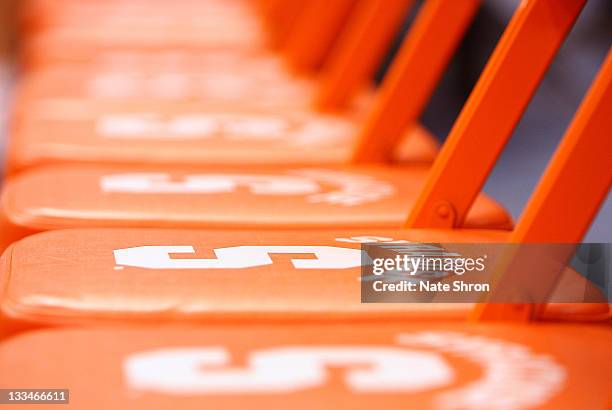 Seats on the Syracuse bench with the Syracuse Orange logo are seen prior to the game against the Colgate Raiders at the Carrier Dome on November 19,...