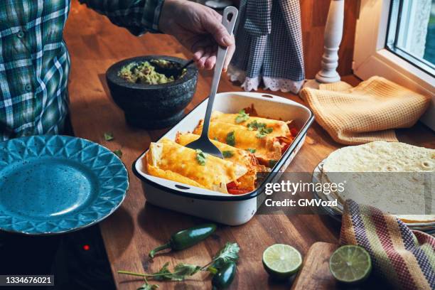 rolled tortilla stuffed with shredded chicken - enchilada stock pictures, royalty-free photos & images