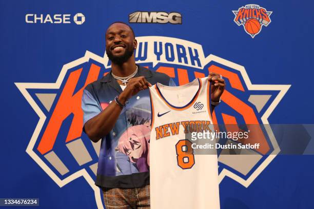 Kemba Walker of the New York Knicks holds up his jersey after being introduced a press event at Madison Square Garden on August 17, 2021 in New York...