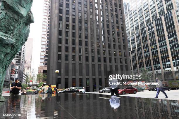 People walk past the CBS Building, also known as the Black Rock building on August 17, 2021 in New York City. ViacomCBS is selling the building to...