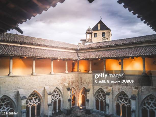 interior view of the cloister of ambronay abbey in france in autumn weather - abbey of montserrat stockfoto's en -beelden