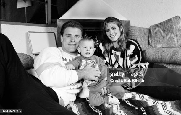 Los Angeles Raiders Howie Long, 8-month-old son Christopher and his wife Diane at home, December 20, 1986 in Redondo Beach, California.