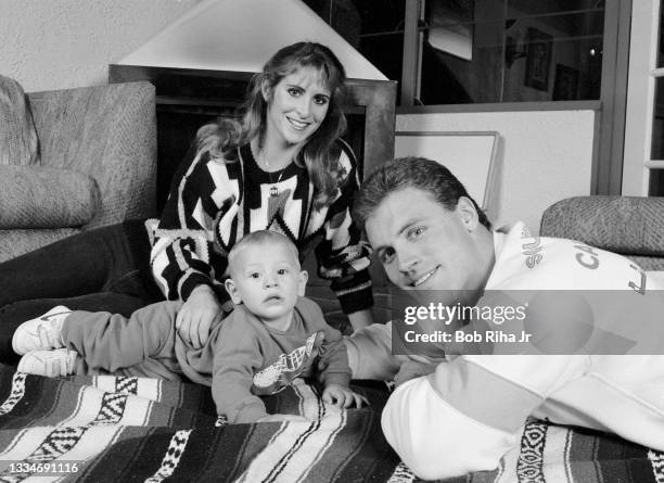 Los Angeles Raiders Howie Long, 8-month-old son Christopher and his wife Diane at home, December 20, 1986 in Redondo Beach, California.