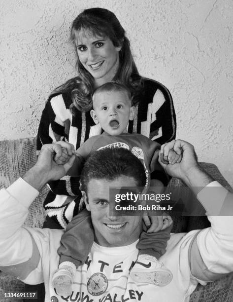 Los Angeles Raiders Howie Long, 8-month-old son Christopher and his wife Diane at home, December 20, 1986 in Redondo Beach, California.