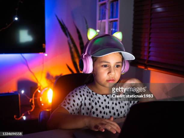 happy girl gamer playing video games. - cyber punk girl stock pictures, royalty-free photos & images