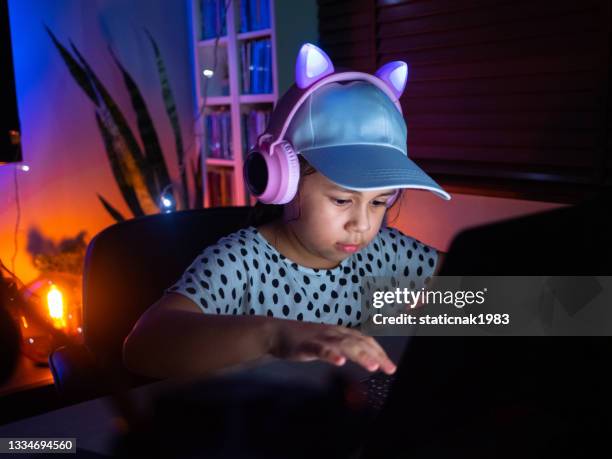 a girl playing online games. - identity thief film stock pictures, royalty-free photos & images