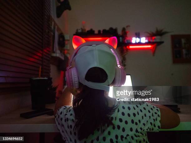 girl playing game live streaming on laptop - cyber punk girl stock pictures, royalty-free photos & images