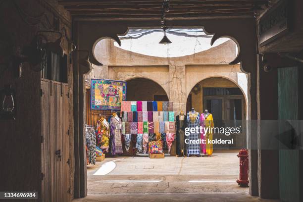 traditional textile store in dubai - al fahidi fort stock pictures, royalty-free photos & images