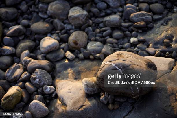 high angle view of pebbles on beach,vizcaya,spain - edv stock pictures, royalty-free photos & images