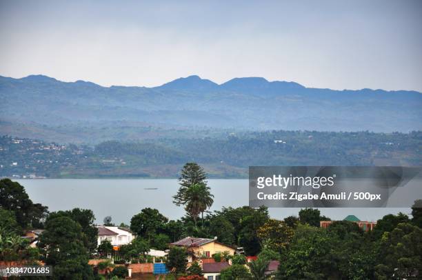 scenic view of lake and mountains against sky,bukavu,democratic republic of congo - democratic republic of the congo stock pictures, royalty-free photos & images