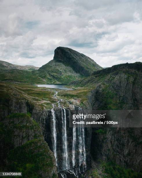 scenic view of waterfall against sky,hemsedal,norway - norway stock-fotos und bilder