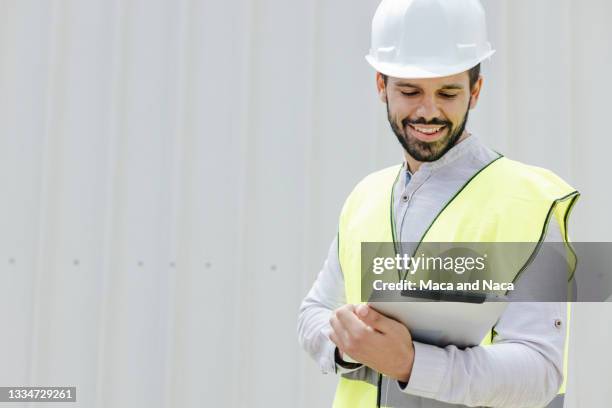 Construction Worker With Ipad On White Photos and Premium High Res ...